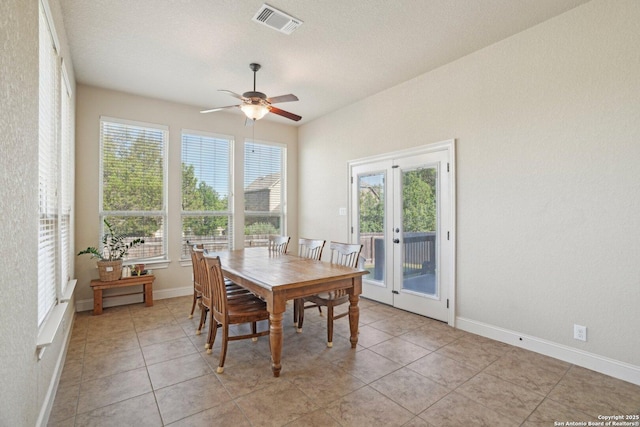 dining room with visible vents, ceiling fan, plenty of natural light, and light tile patterned floors