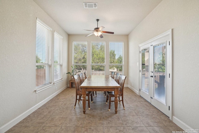 dining room featuring light tile patterned floors, visible vents, french doors, and a ceiling fan