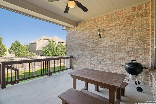 view of patio / terrace featuring fence, a ceiling fan, and area for grilling