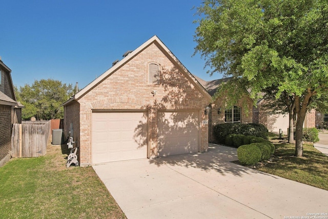 view of front of property featuring central AC unit, a garage, fence, concrete driveway, and brick siding