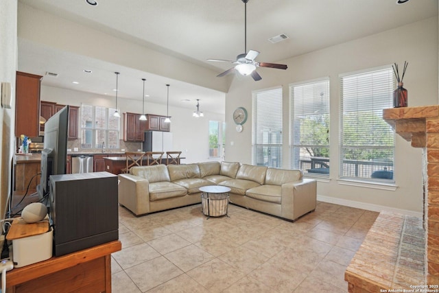 living room featuring light tile patterned floors, a ceiling fan, visible vents, recessed lighting, and baseboards