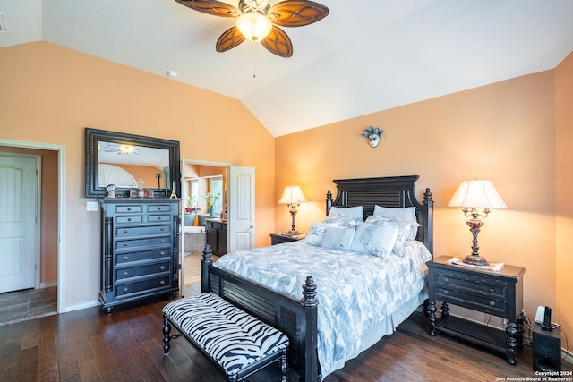 bedroom featuring baseboards, wood finished floors, connected bathroom, and lofted ceiling