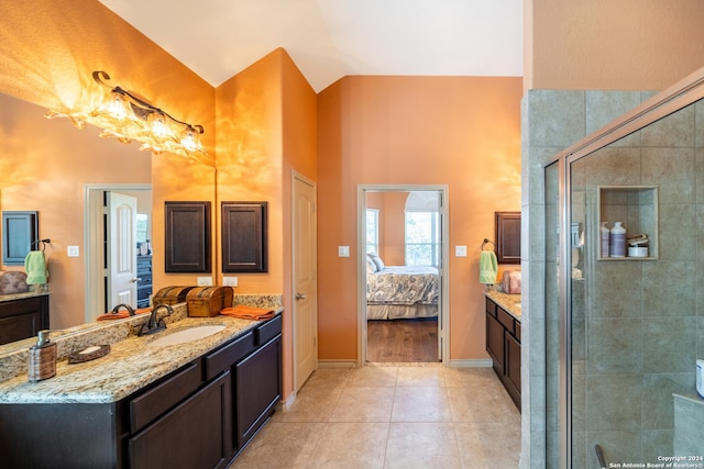 full bath with a stall shower, high vaulted ceiling, tile patterned flooring, and vanity