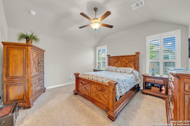 bedroom featuring visible vents, baseboards, a ceiling fan, light colored carpet, and lofted ceiling