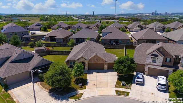 birds eye view of property with a residential view