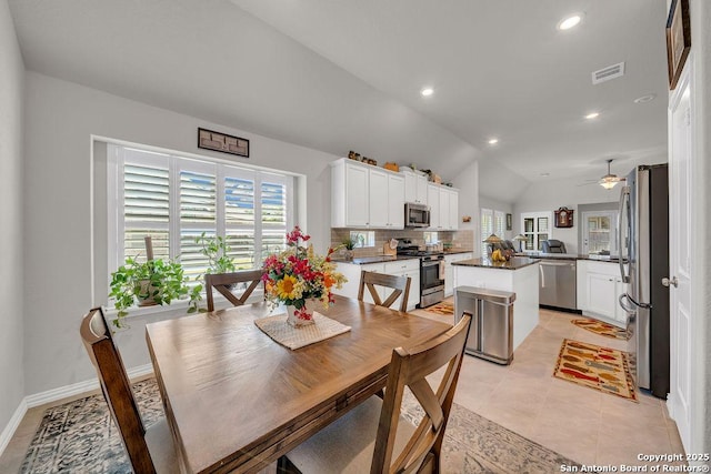dining area featuring ceiling fan, visible vents, recessed lighting, light tile patterned flooring, and lofted ceiling