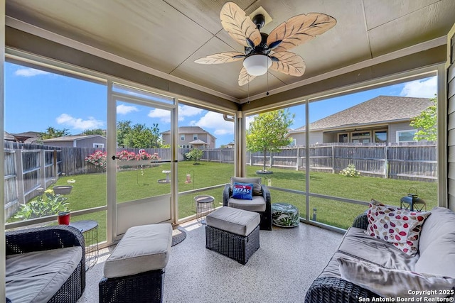 sunroom with an outdoor living space and ceiling fan