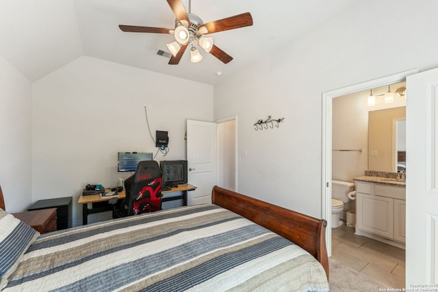 581 Vale Ct, New Braunfels, TX 78132 - bedroom featuring visible vents, light tile patterned floors, ensuite bathroom, a ceiling fan, and vaulted ceiling