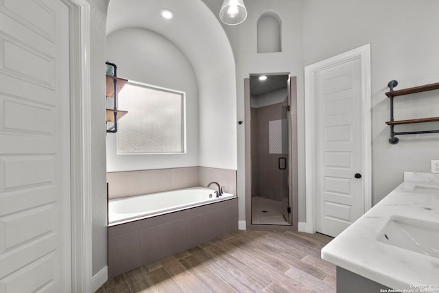 291 Strasbourg, Castroville, TX 78009 - full bath with a shower stall, a bath, wood finished floors, and double vanity