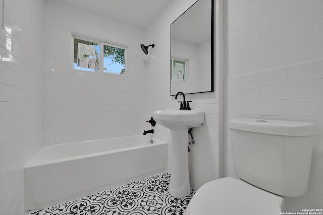 162 Birchwood, San Antonio, TX 78213 - bathroom with tub / shower combination, tile patterned flooring, toilet, wainscoting, and tile walls