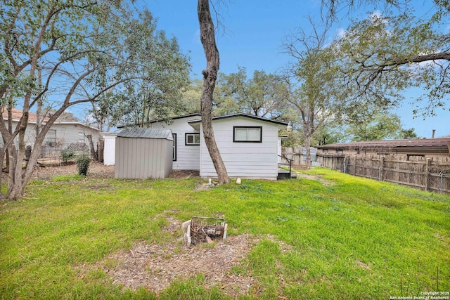 162 Birchwood, San Antonio, TX 78213 - back of house featuring a shed, an outdoor structure, fence, and a lawn