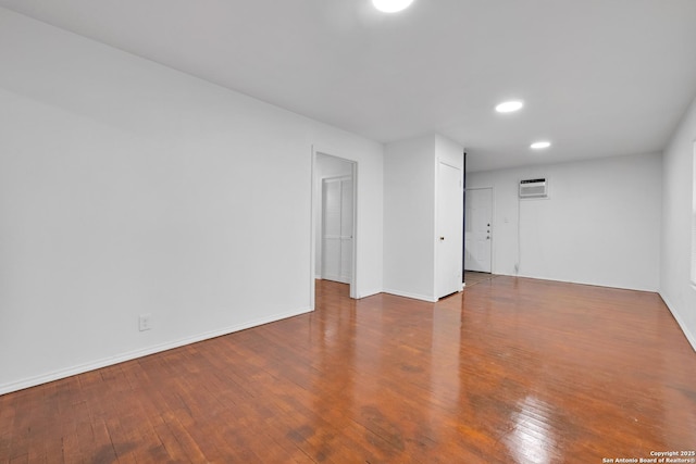 162 Birchwood, San Antonio, TX 78213 - unfurnished room with wood-type flooring, baseboards, recessed lighting, and a wall mounted AC