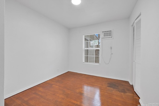 162 Birchwood, San Antonio, TX 78213 - unfurnished room featuring a wall unit AC, wood-type flooring, and baseboards