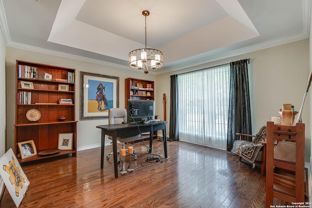 office space with crown molding, a notable chandelier, a raised ceiling, and hardwood / wood-style floors