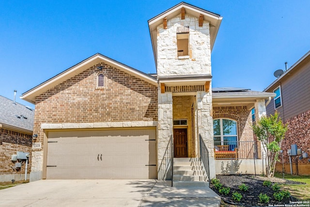 22438 Akin Fawn, San Antonio, TX 78261 - view of front of property featuring a garage, stone siding, driveway, and solar panels