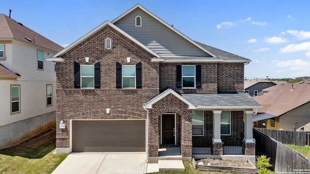 29991 Jove, Bulverde, TX 78163 - traditional-style home featuring covered porch, fence, brick siding, an attached garage, and concrete driveway