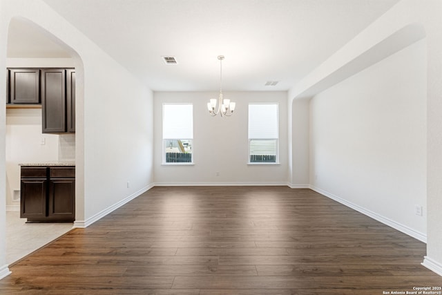 29991 Jove, Bulverde, TX 78163 - unfurnished dining area with visible vents, baseboards, a notable chandelier, and dark wood-style floors
