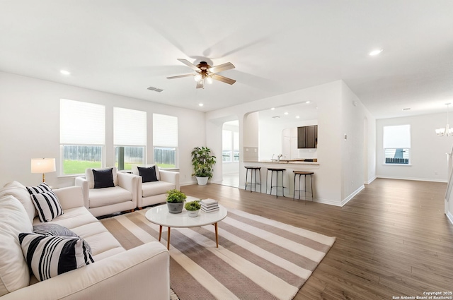 29991 Jove, Bulverde, TX 78163 - living room featuring light wood-style floors, ceiling fan with notable chandelier, baseboards, and recessed lighting