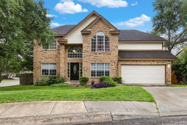 1102 Straight Arrow, San Antonio, TX 78258 - traditional-style house with driveway, a garage, brick siding, and roof with shingles