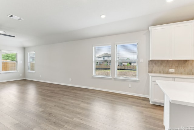 10214 King Robert, San Antonio, TX 78239 - unfurnished dining area featuring light wood-style floors, plenty of natural light, baseboards, ceiling fan, and recessed lighting