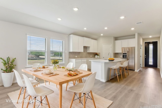10214 King Robert, San Antonio, TX 78239 - dining area with light wood-type flooring, recessed lighting, and baseboards