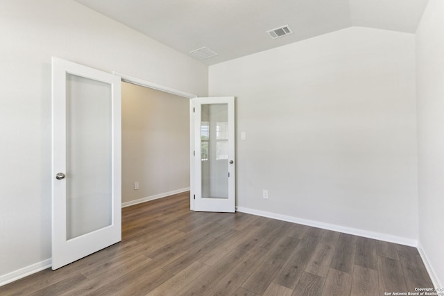 10214 King Robert, San Antonio, TX 78239 - unfurnished bedroom featuring french doors, wood finished floors, baseboards, and lofted ceiling