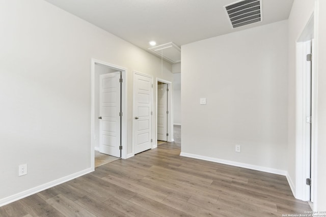 10214 King Robert, San Antonio, TX 78239 - unfurnished bedroom with attic access, wood finished floors, baseboards, and recessed lighting