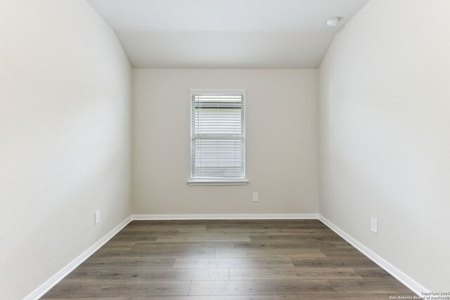 10214 King Robert, San Antonio, TX 78239 - unfurnished room featuring wood finished floors, baseboards, and a smoke detector