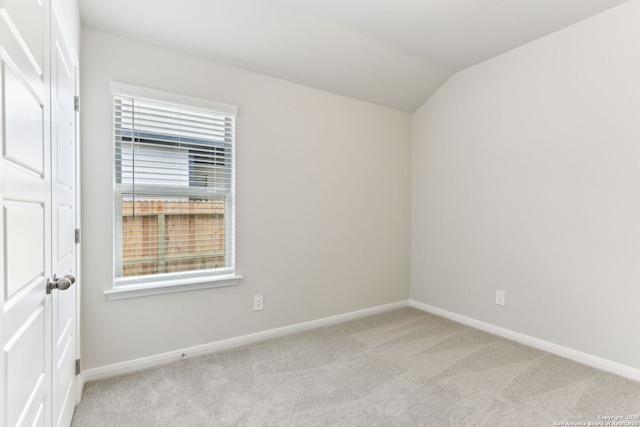 10214 King Robert, San Antonio, TX 78239 - empty room featuring carpet floors, baseboards, and vaulted ceiling