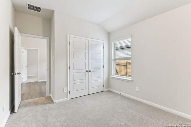10214 King Robert, San Antonio, TX 78239 - unfurnished bedroom with carpet flooring, a closet, baseboards, and lofted ceiling