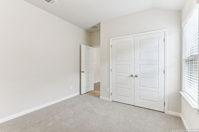 10214 King Robert, San Antonio, TX 78239 - unfurnished bedroom featuring light colored carpet, a closet, baseboards, and lofted ceiling