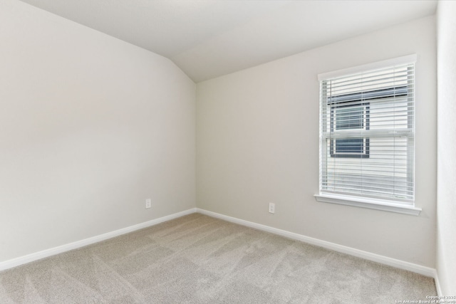 10214 King Robert, San Antonio, TX 78239 - unfurnished room featuring light carpet, baseboards, lofted ceiling, and healthy amount of natural light