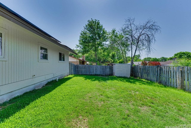 view of yard with a fenced backyard