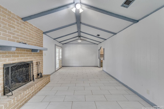 unfurnished living room with a fireplace, lofted ceiling with beams, a ceiling fan, and visible vents