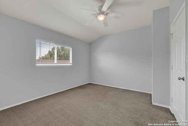 empty room featuring carpet flooring, baseboards, and a ceiling fan