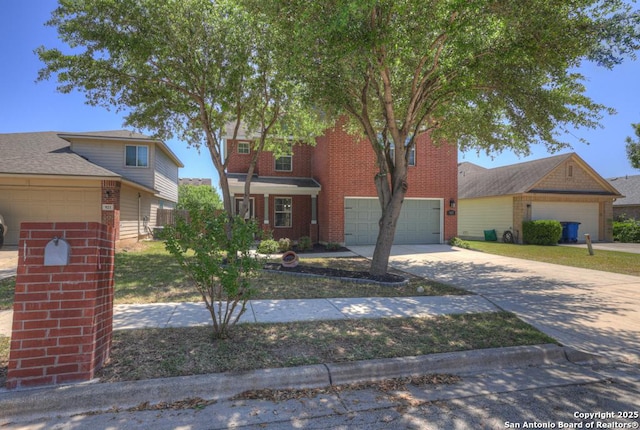 traditional home with brick siding and concrete driveway