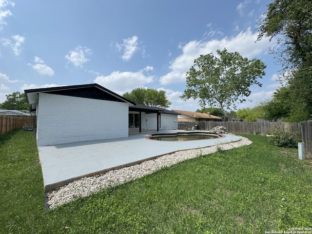 2410 Townbreeze, San Antonio, TX 78238 - rear view of house with a patio area, brick siding, and a fenced backyard