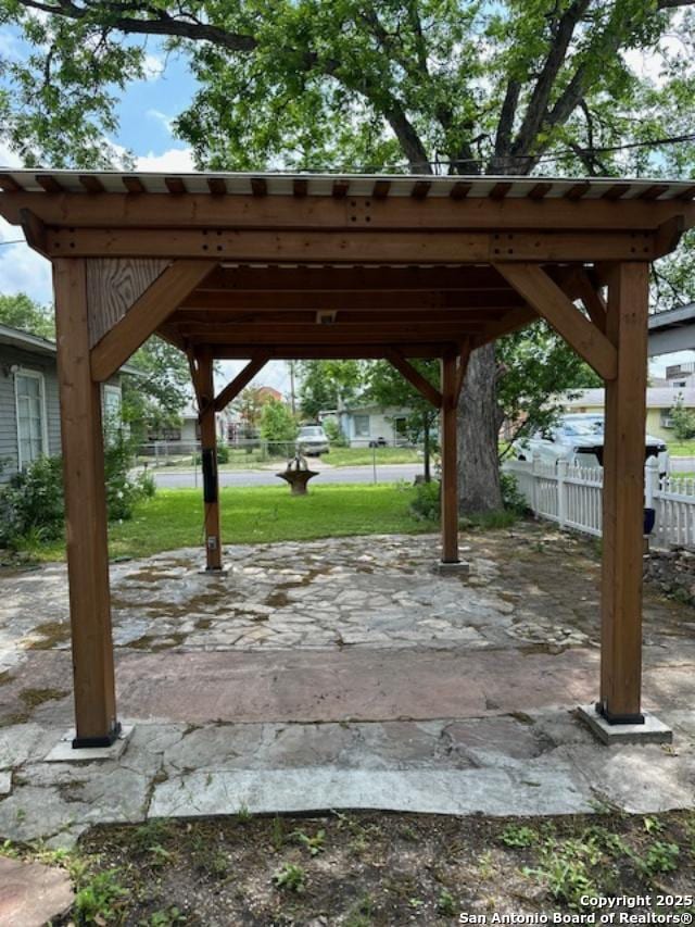726 Southcross, San Antonio, TX 78211 - view of patio featuring fence and a carport