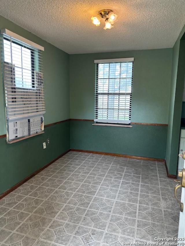 726 Southcross, San Antonio, TX 78211 - empty room with baseboards and a textured ceiling