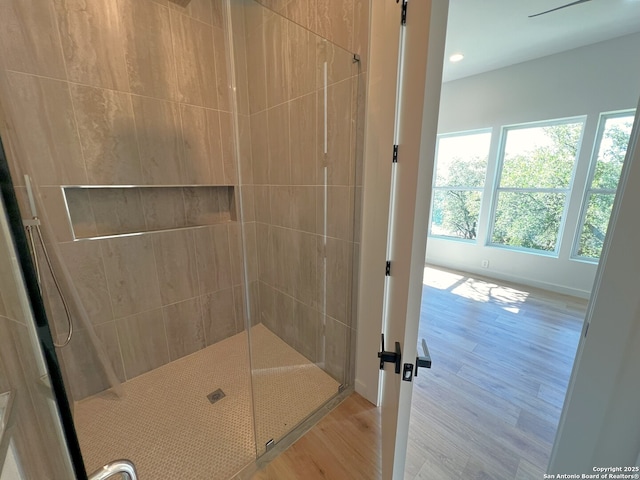 707 Lone Cir, San Antonio, TX 78260 - full bath with a tile shower, recessed lighting, and wood finished floors
