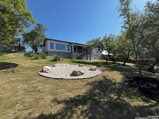 707 Lone Cir, San Antonio, TX 78260 - exterior space with stairs, stucco siding, fence, and a front lawn