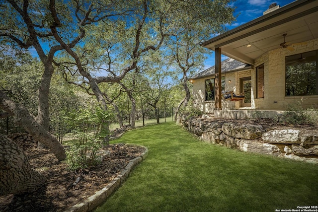 view of yard with a ceiling fan