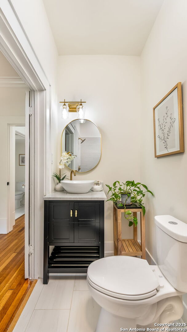 315 Carnahan, San Antonio, TX 78209 - bathroom with vanity, baseboards, and toilet