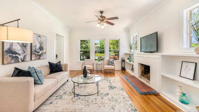 315 Carnahan, San Antonio, TX 78209 - living room with crown molding, a healthy amount of sunlight, wood finished floors, and a ceiling fan