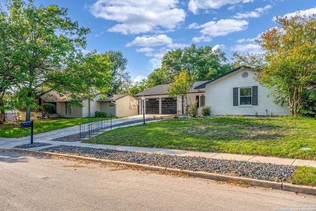 2727 Belvoir, San Antonio, TX 78230 - ranch-style house featuring an attached garage, concrete driveway, a front lawn, and brick siding
