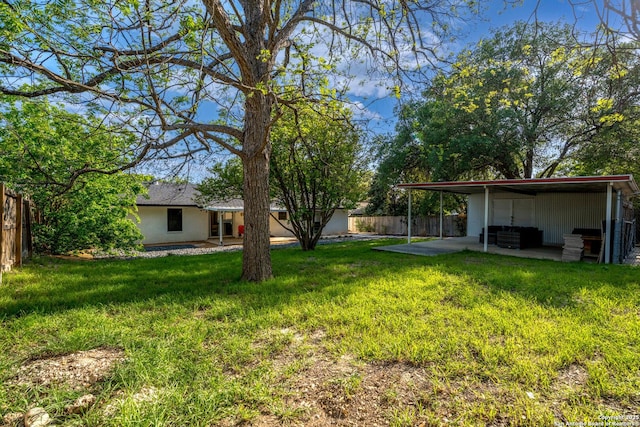 2727 Belvoir, San Antonio, TX 78230 - view of yard featuring a patio area, a carport, and a fenced backyard