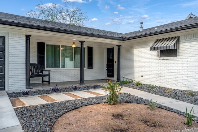 2727 Belvoir, San Antonio, TX 78230 - view of exterior entry with brick siding and a porch