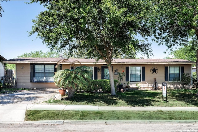 ranch-style house with a front lawn