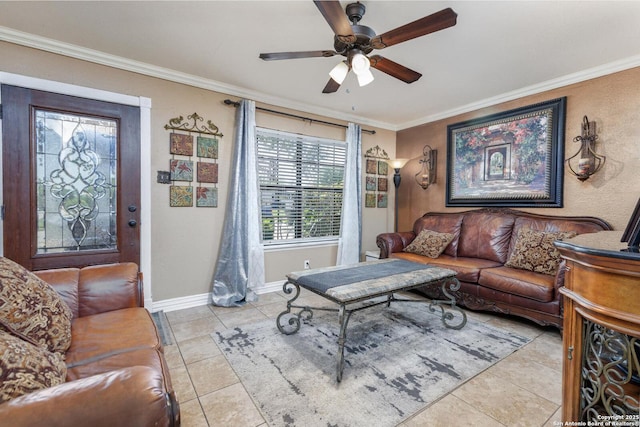 living area with ornamental molding, light tile patterned floors, and ceiling fan