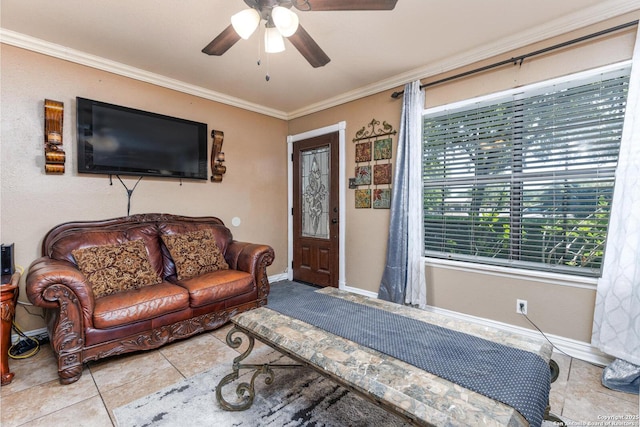 living room with crown molding, ceiling fan, tile patterned flooring, and baseboards
